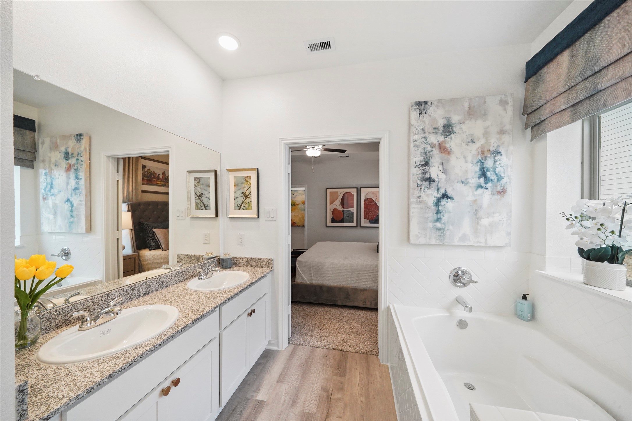604 Danielle Dayton, TX 77535 - Photo 22 of 34 a spacious bathroom with a granite countertop tub sink and mirror