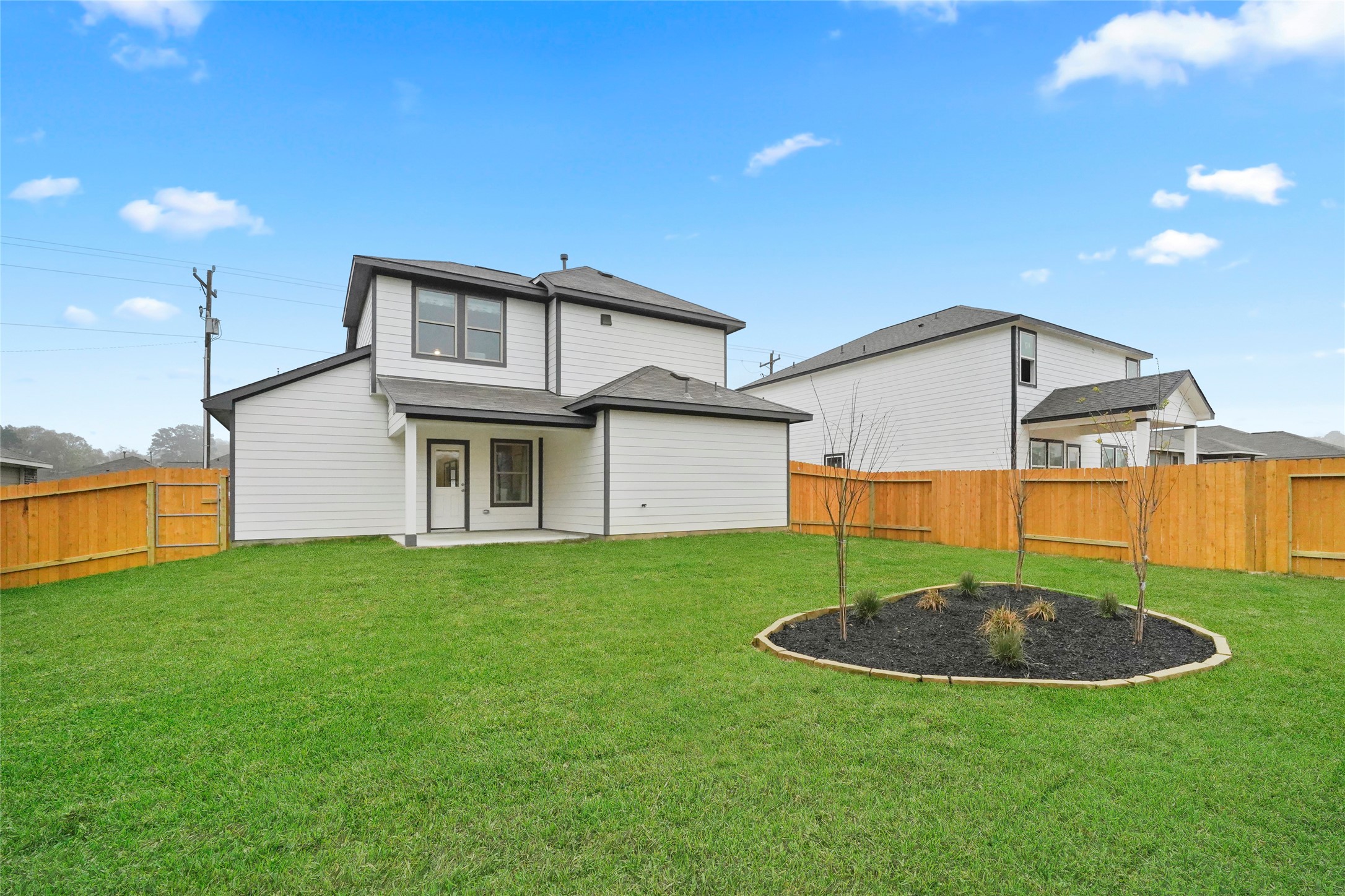 604 Danielle Dayton, TX 77535 - Photo 34 of 34 a view of a house with a yard and sitting area