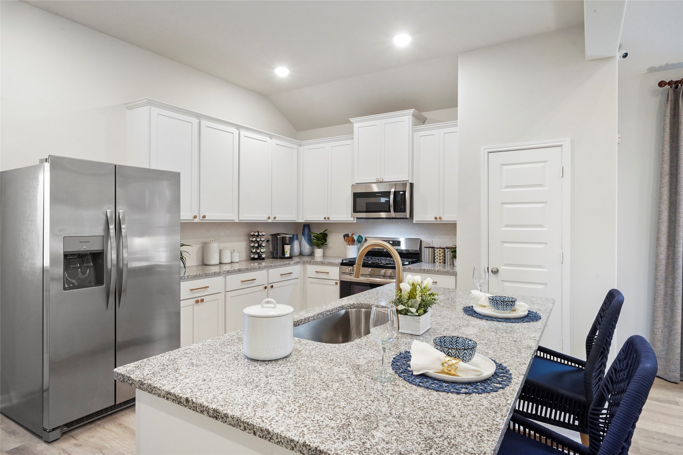 604 Danielle Dayton, TX 77535 - Photo 9 of 34 a kitchen with stainless steel appliances granite countertop a sink a stove a refrigerator cabinets and a dining table