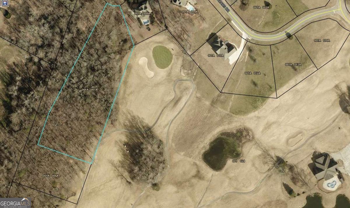 203 Adams Drive Commerce, GA 30530 - Photo 10 of 10 a bathroom with a bathtub