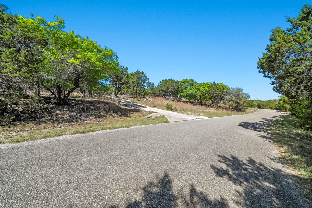 716 Ridge Oak Drive Wimberley, TX 78676 - Photo 3 of 16 a view of a dirt road and a building
