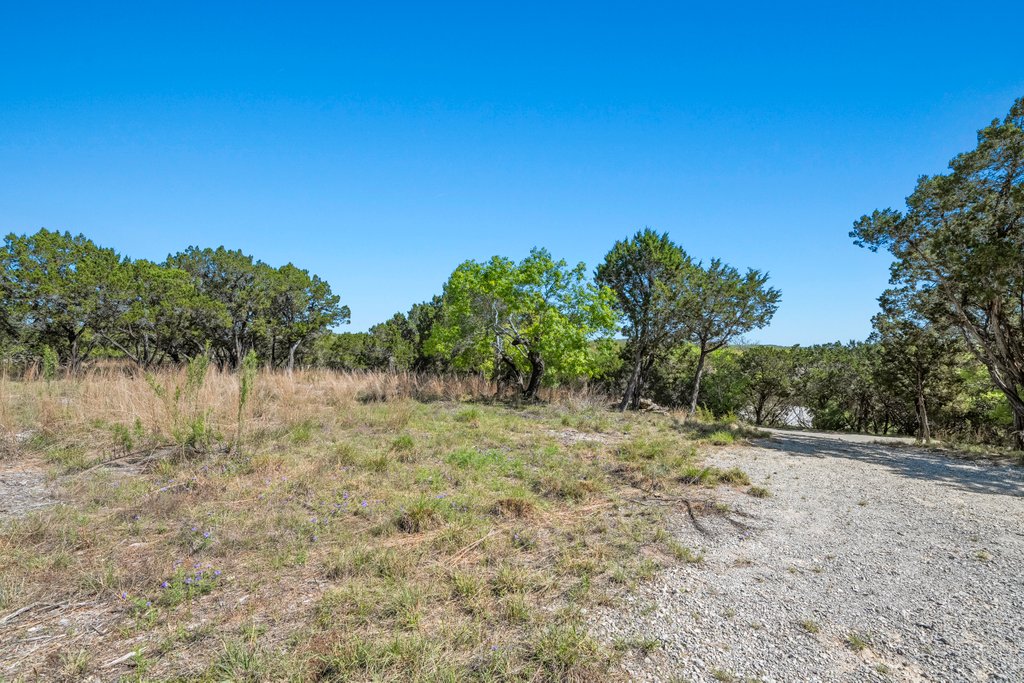 716 Ridge Oak Drive Wimberley, TX 78676 - Photo 7 of 16 a view of a lake with a yard