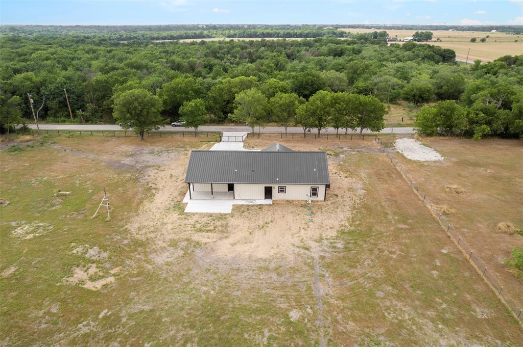 121 Brazier Road Ennis, TX 75119 - Photo 26 of 31 a view of a dry yard with trees