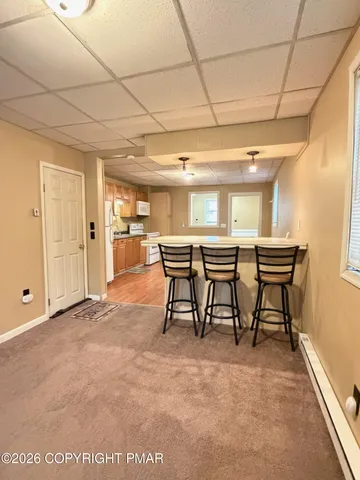 a view of a storage & utility room with a window
