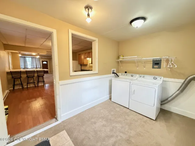 a bathroom with a granite countertop sink a toilet and bathtub