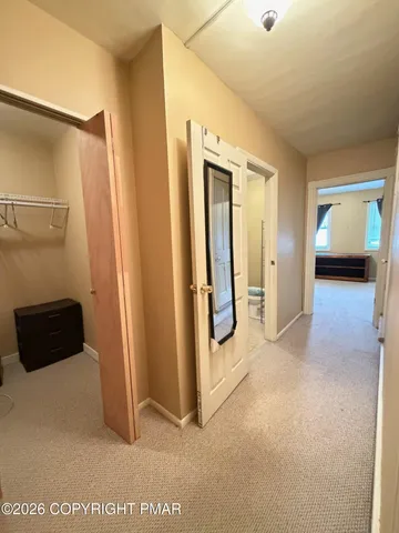 a view of an empty room with a window