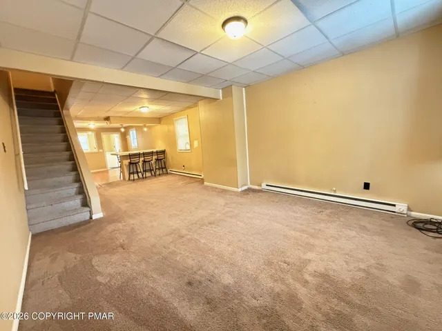 a view of a livingroom with furniture and a window