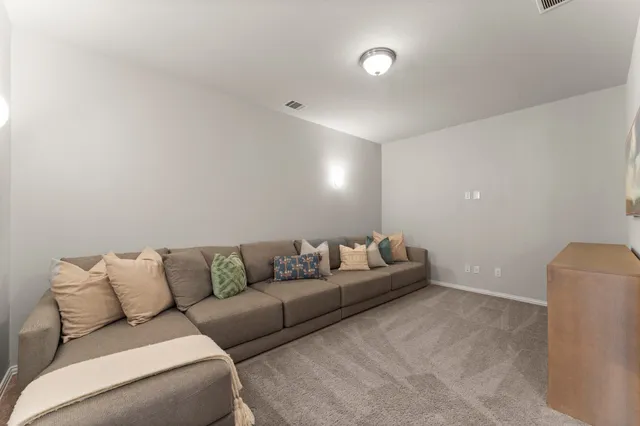 a living room with furniture and a couch