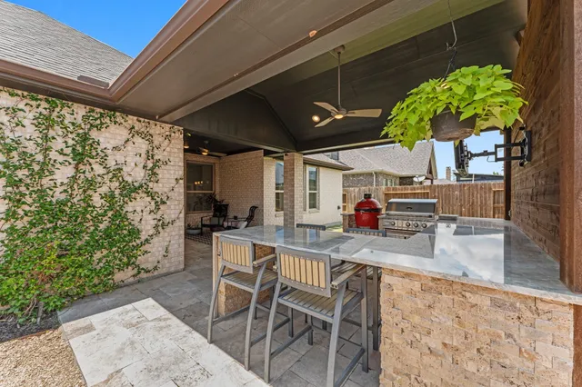 a view of a backyard with sitting area