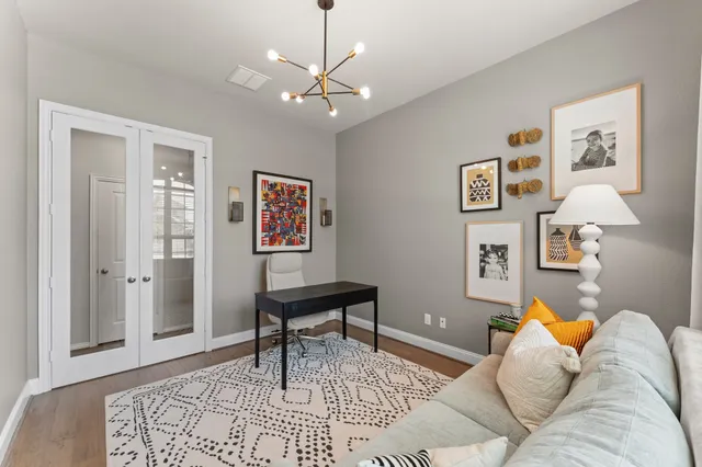 a living room with furniture and a rug