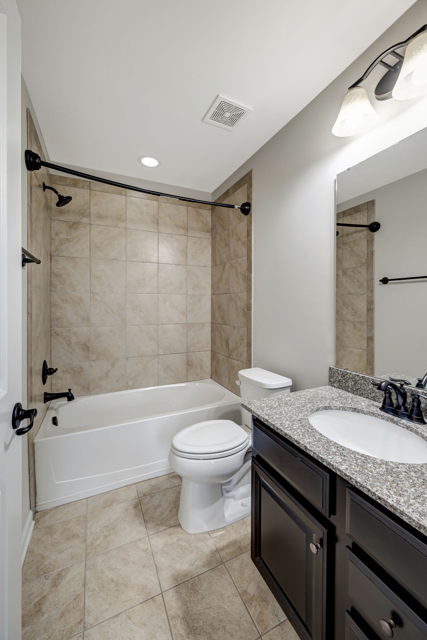 106 Shanache Drive Spring Hill, TN 37174 - Photo 20 of 31 a bathroom with a granite countertop sink toilet and shower