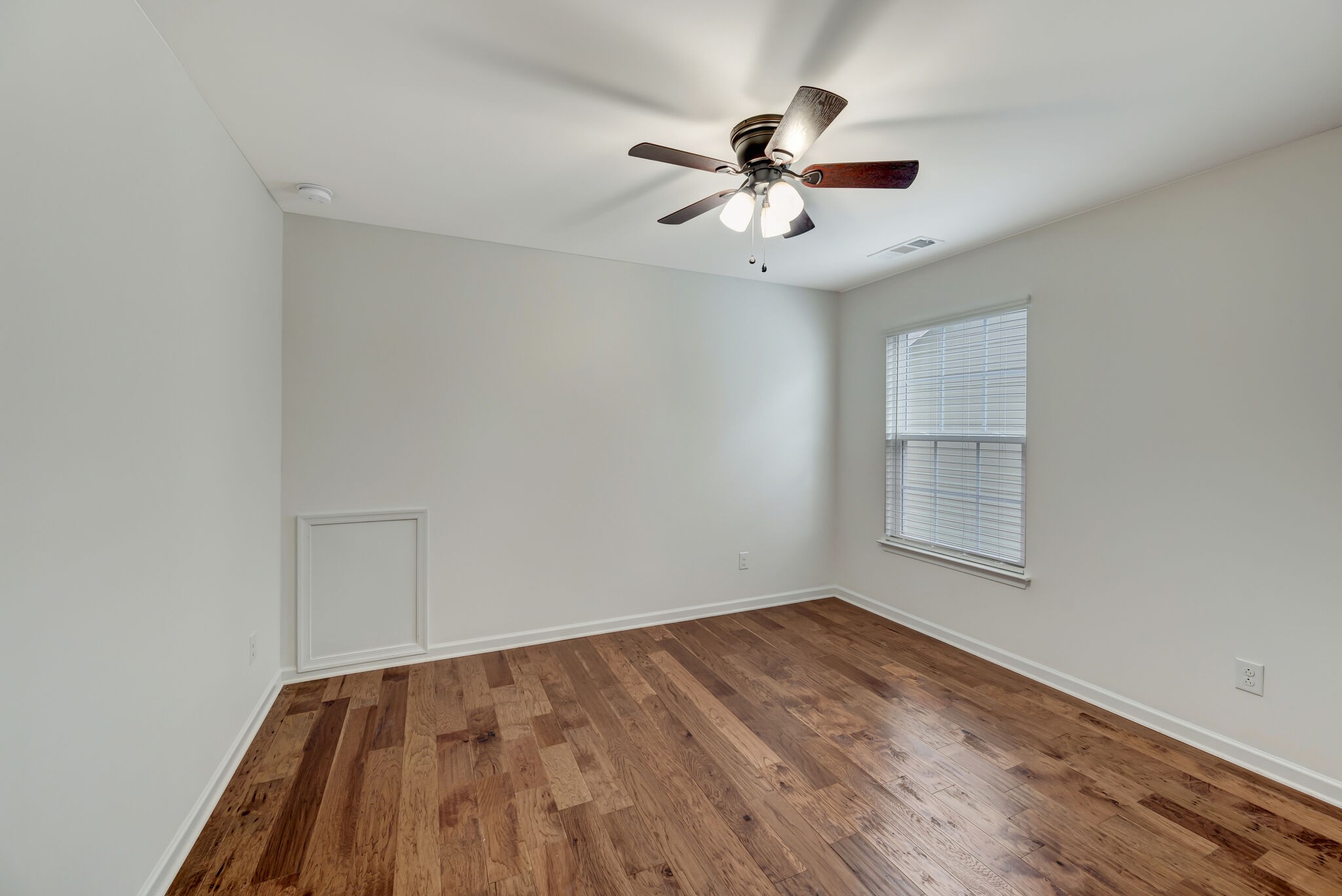 106 Shanache Drive Spring Hill, TN 37174 - Photo 23 of 31 wooden floor in an empty room with a window