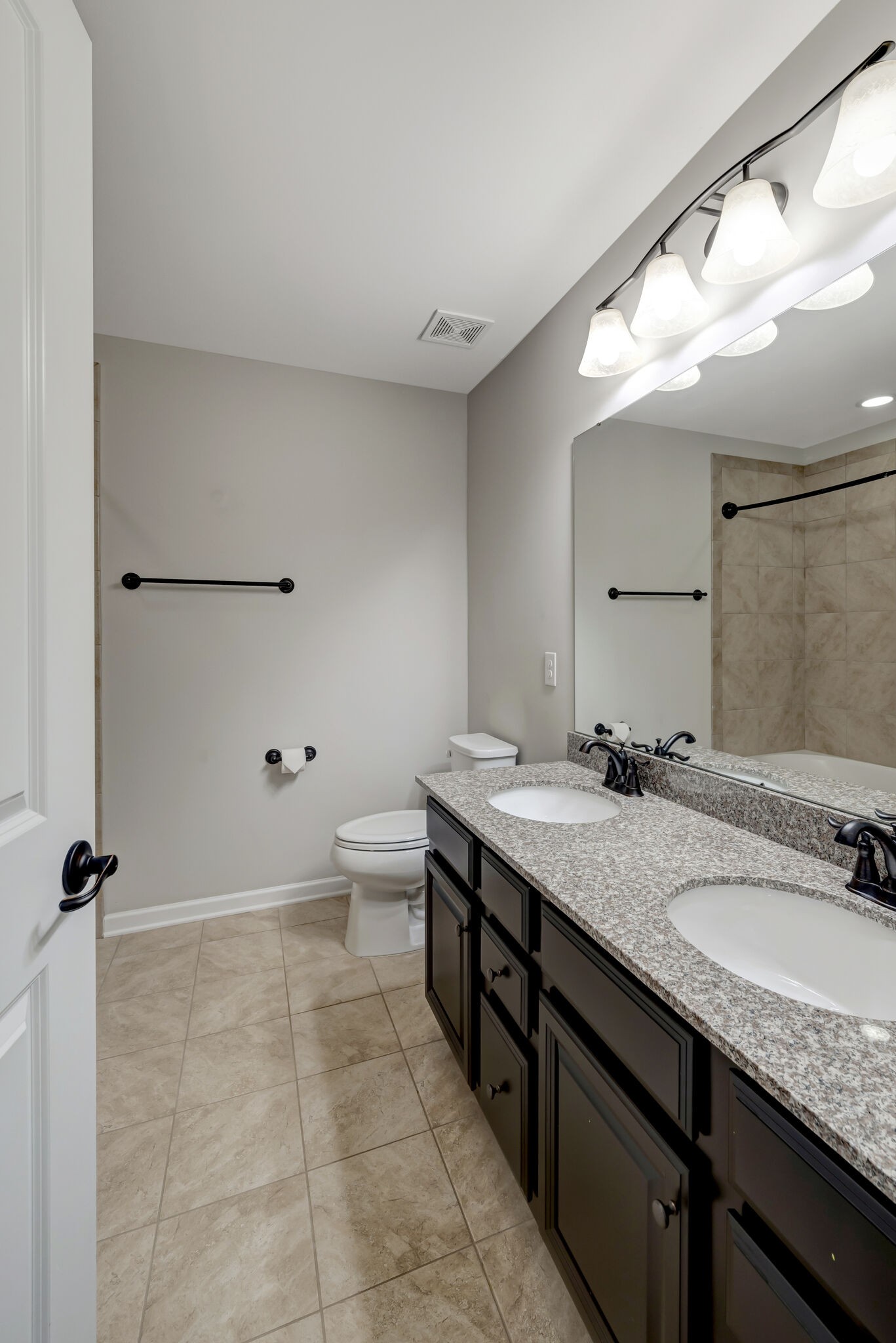 106 Shanache Drive Spring Hill, TN 37174 - Photo 25 of 31 a bathroom with a granite countertop sink mirror and toilet