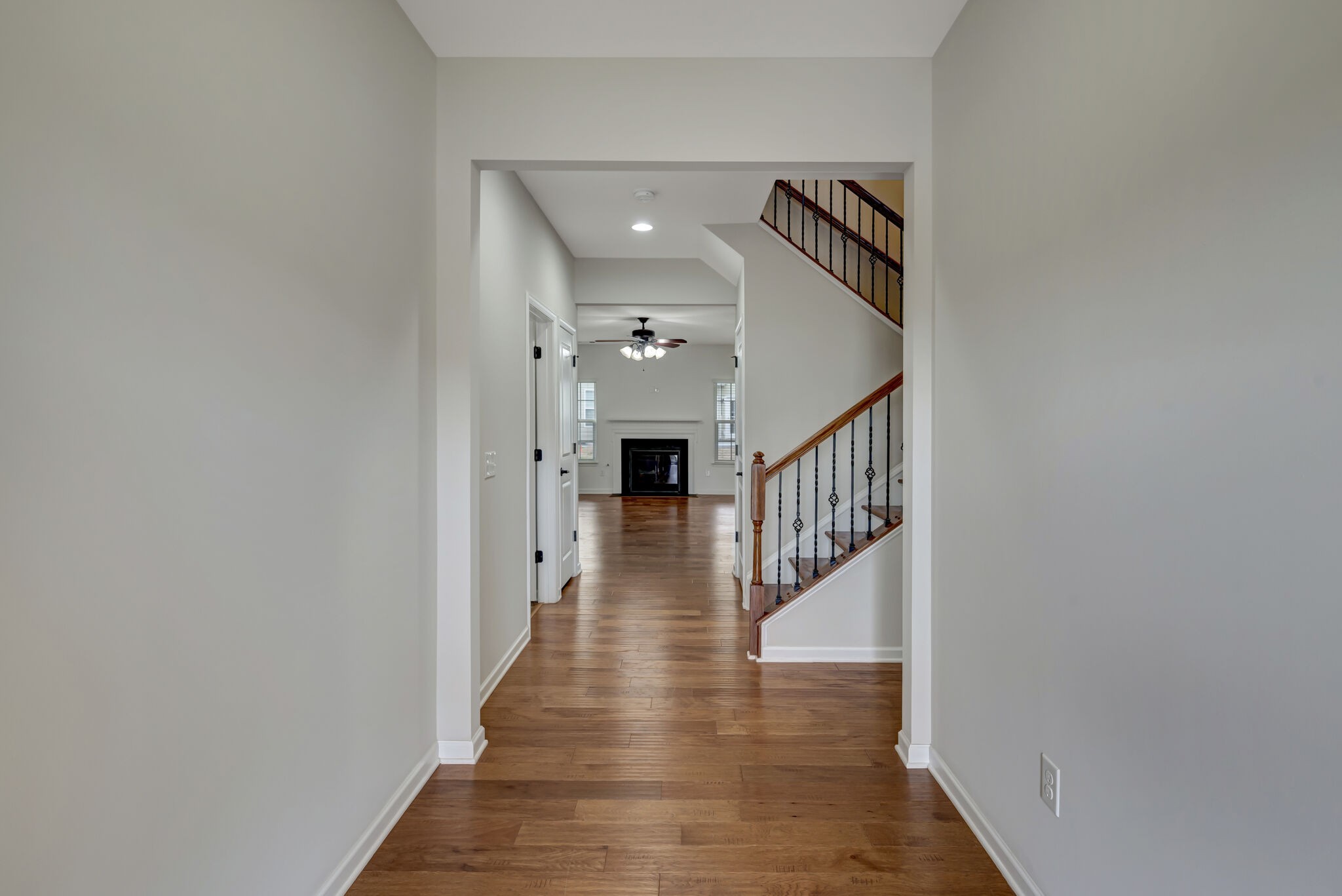 106 Shanache Drive Spring Hill, TN 37174 - Photo 3 of 31 a view of a hallway with wooden floor and staircase