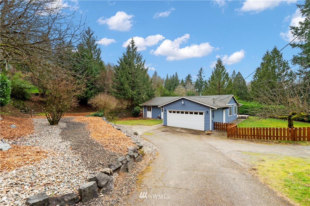 1900 Higgins Road Southeast Port Orchard, WA 98366 - Photo 1 of 26 a view of a house with a yard
