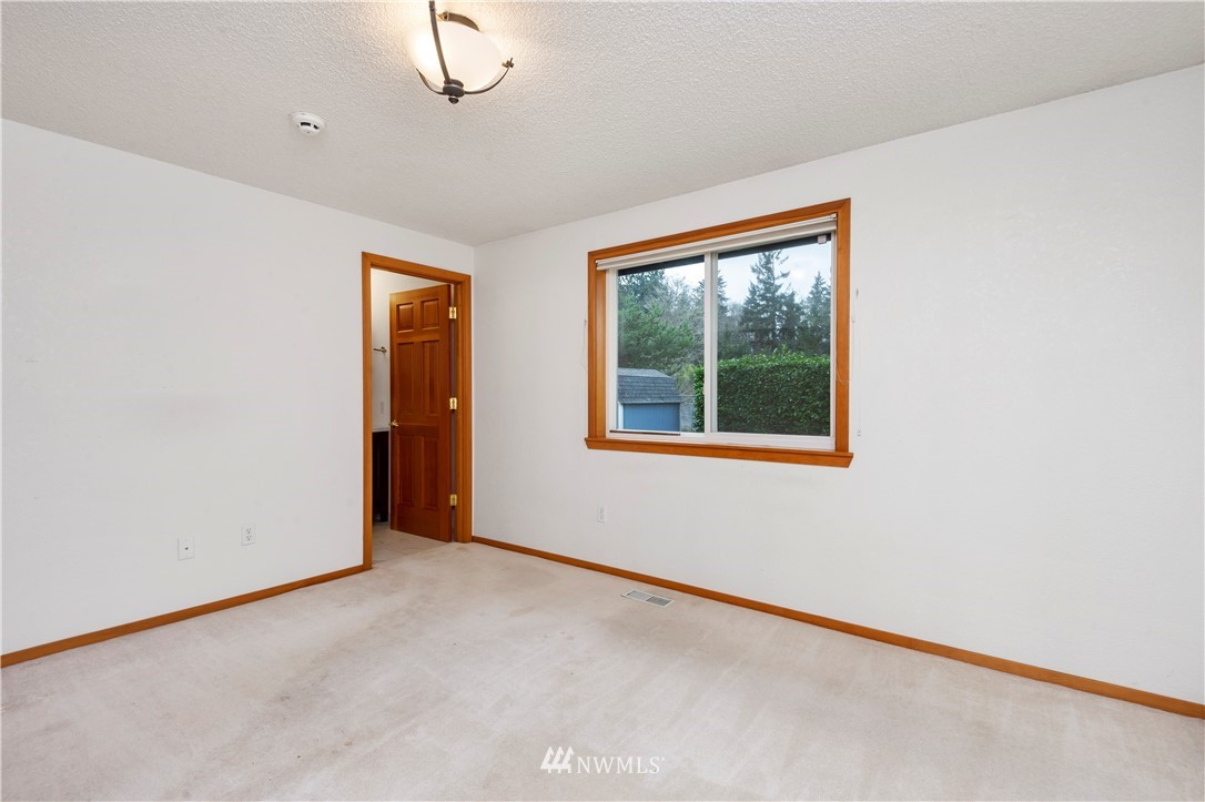 1900 Higgins Road Southeast Port Orchard, WA 98366 - Photo 11 of 26 an empty room with window