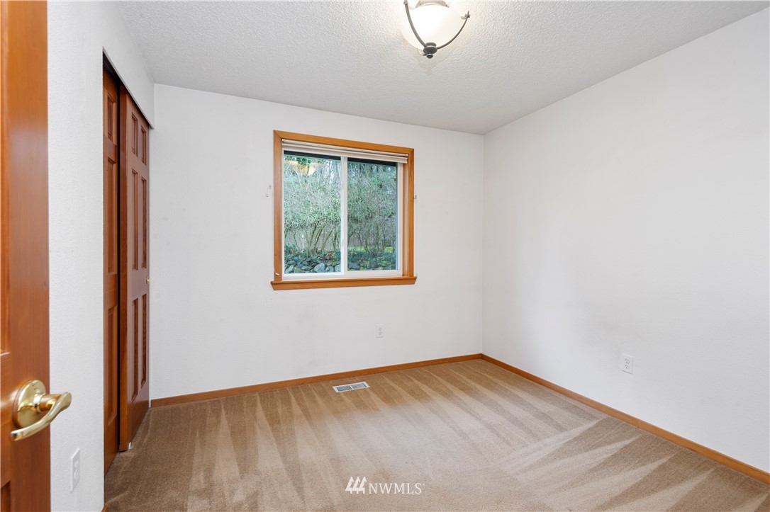 1900 Higgins Road Southeast Port Orchard, WA 98366 - Photo 13 of 26 an empty room with a window