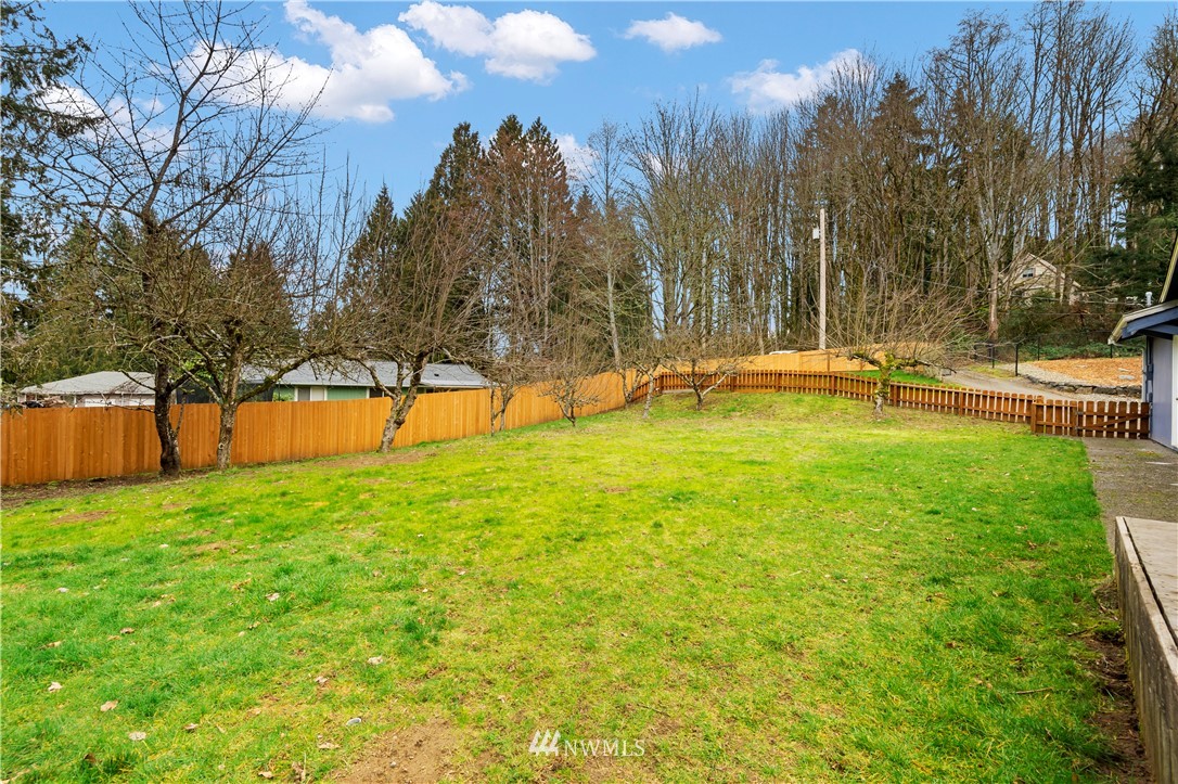 1900 Higgins Road Southeast Port Orchard, WA 98366 - Photo 21 of 26 a view of swimming pool with an outdoor space and seating area