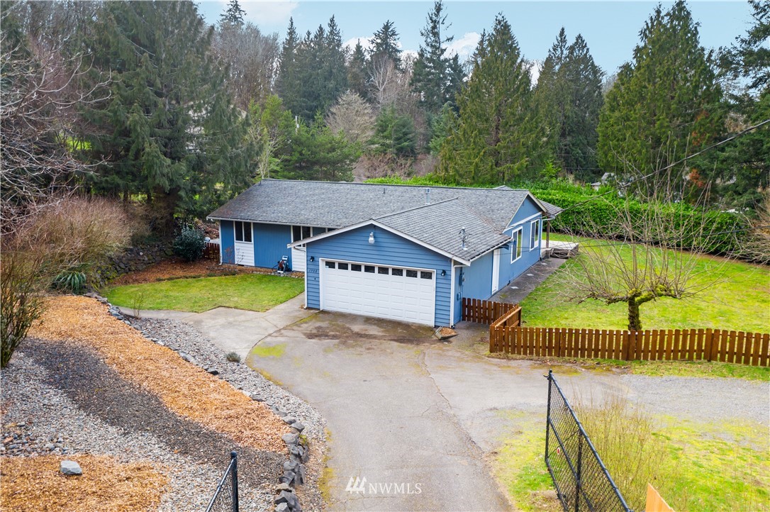 1900 Higgins Road Southeast Port Orchard, WA 98366 - Photo 25 of 26 a house with a trees in the background