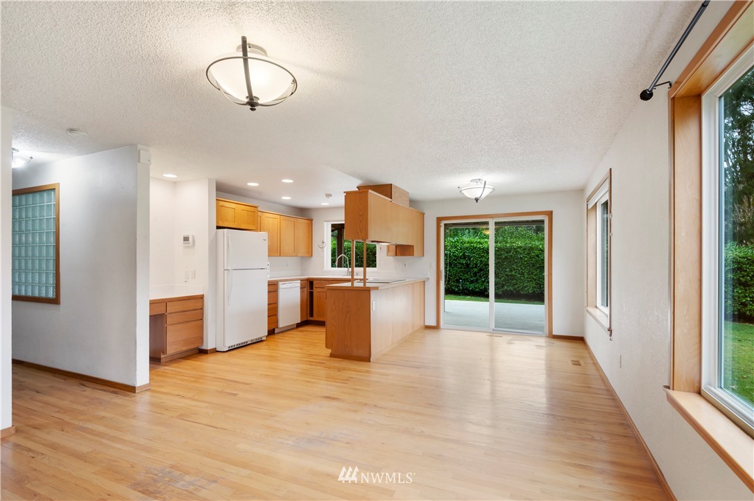 1900 Higgins Road Southeast Port Orchard, WA 98366 - Photo 5 of 26 a view of a kitchen with furniture and a window