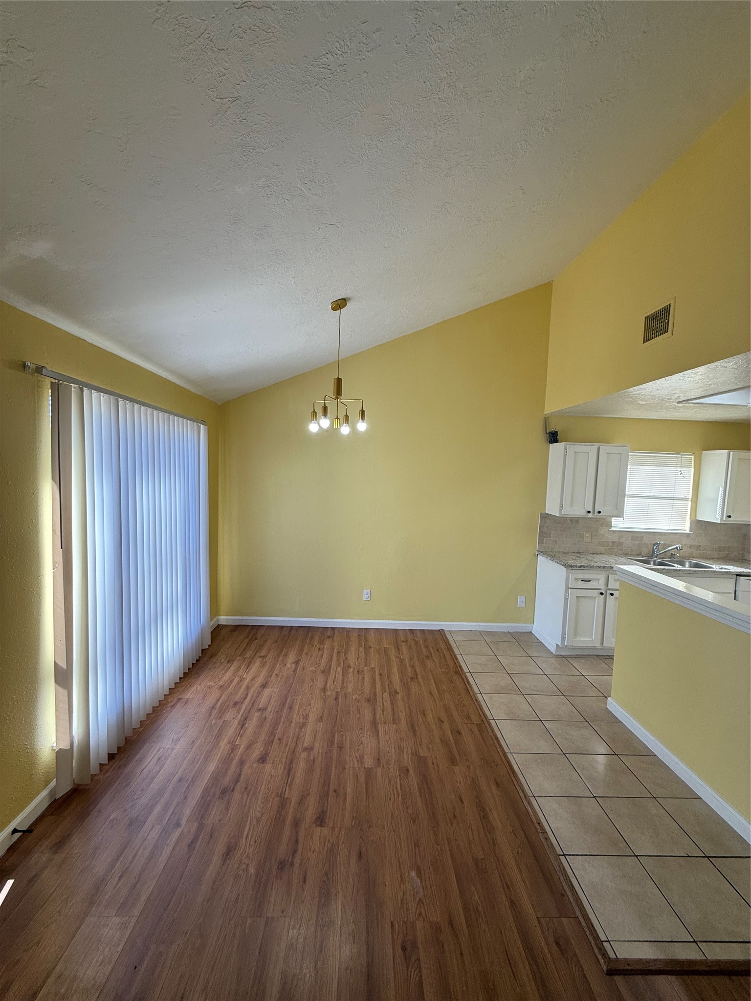 3918 Algernon Drive Spring, TX 77373 - Photo 4 of 17 a view of a kitchen with wooden floor and a sink