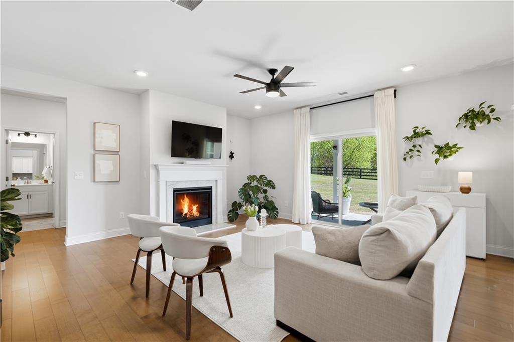 462 Carmichael Circle Canton, GA 30115 - Photo 15 of 70 a living room with furniture a fireplace and a flat screen tv