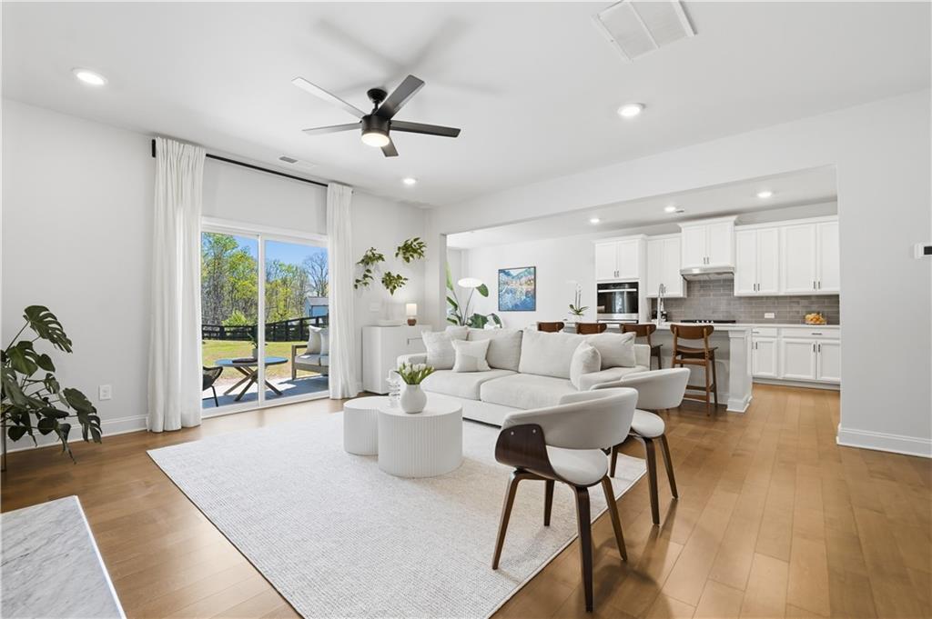 462 Carmichael Circle Canton, GA 30115 - Photo 17 of 70 a living room with furniture and a large window