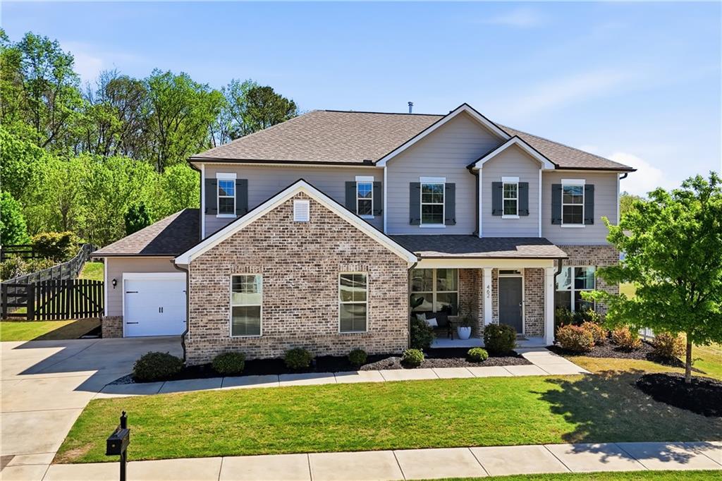462 Carmichael Circle Canton, GA 30115 - Photo 2 of 70 a front view of a house with a yard
