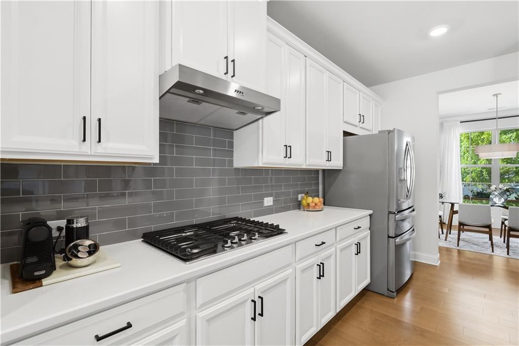 462 Carmichael Circle Canton, GA 30115 - Photo 21 of 70 a kitchen with a sink a stove and refrigerator