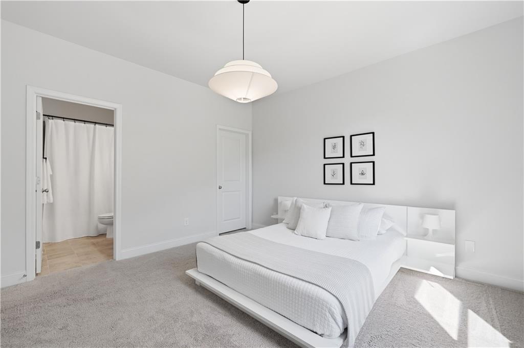 462 Carmichael Circle Canton, GA 30115 - Photo 25 of 70 a bedroom with a bed and a painting on the wall