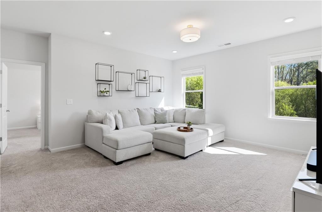 462 Carmichael Circle Canton, GA 30115 - Photo 30 of 70 a living room with furniture and a window