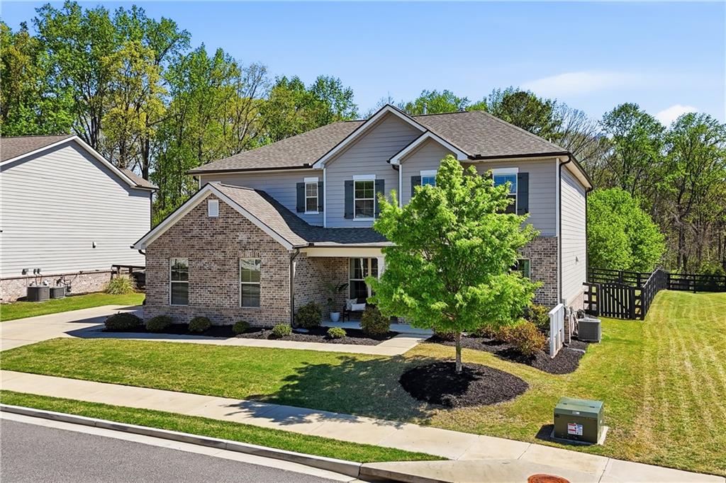 462 Carmichael Circle Canton, GA 30115 - Photo 3 of 70 a front view of a house with a yard