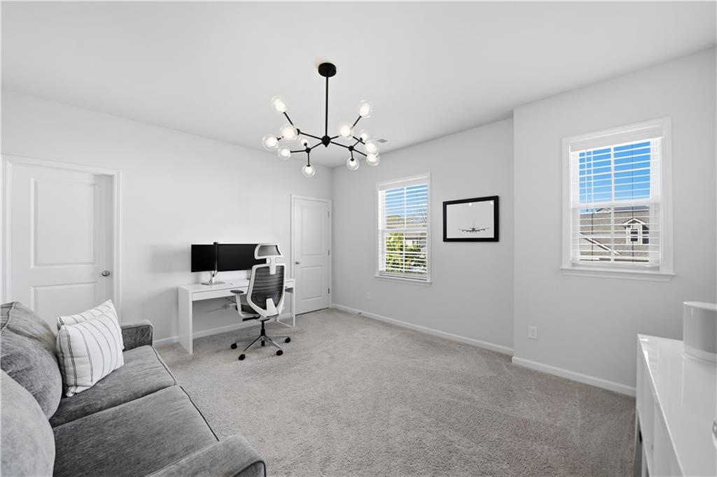 462 Carmichael Circle Canton, GA 30115 - Photo 39 of 70 a view of a livingroom with workspace and a window