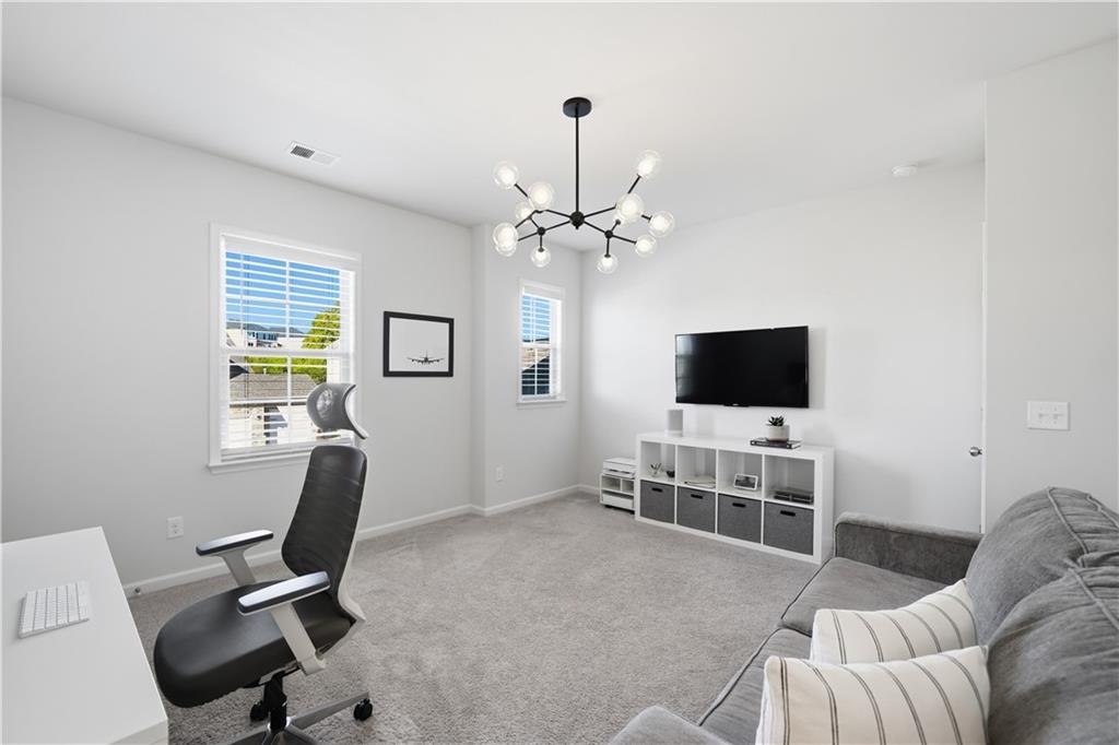 462 Carmichael Circle Canton, GA 30115 - Photo 40 of 70 a view of a livingroom with workspace and a window