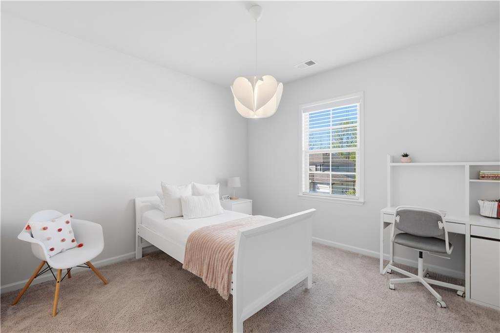 462 Carmichael Circle Canton, GA 30115 - Photo 42 of 70 a bedroom with a bed and furniture