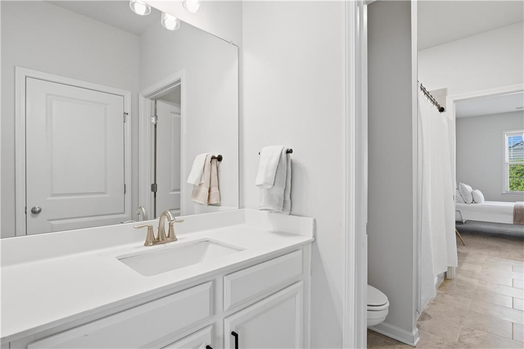 462 Carmichael Circle Canton, GA 30115 - Photo 43 of 70 a bathroom with a sink and a mirror