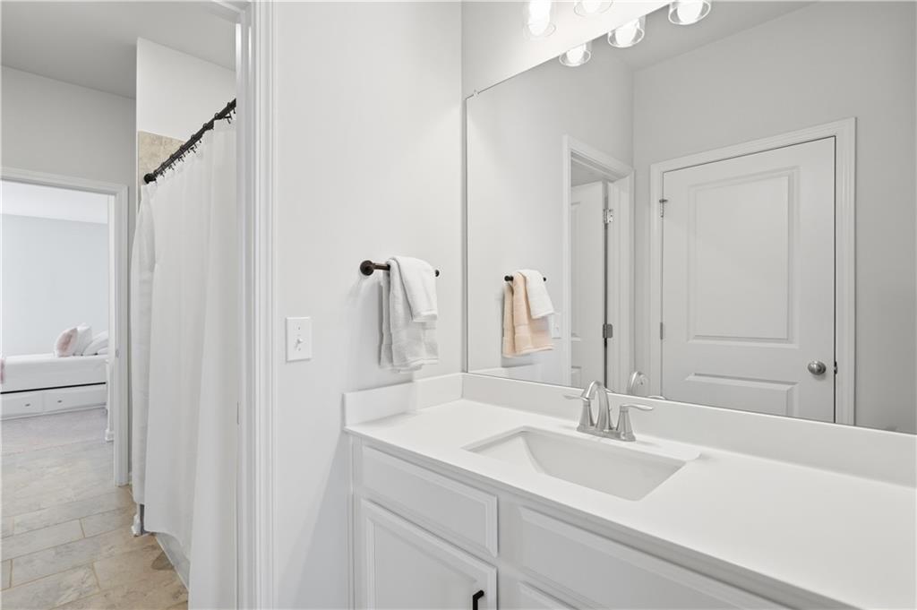 462 Carmichael Circle Canton, GA 30115 - Photo 45 of 70 a bathroom with a sink and a mirror