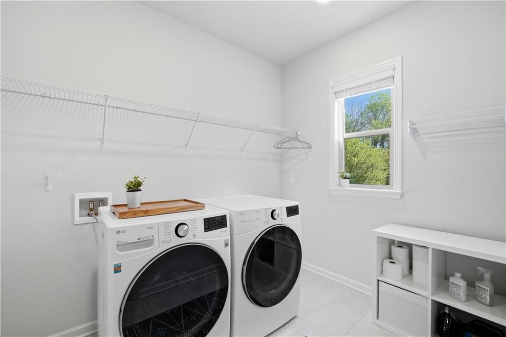462 Carmichael Circle Canton, GA 30115 - Photo 46 of 70 a utility room with dryer and washer