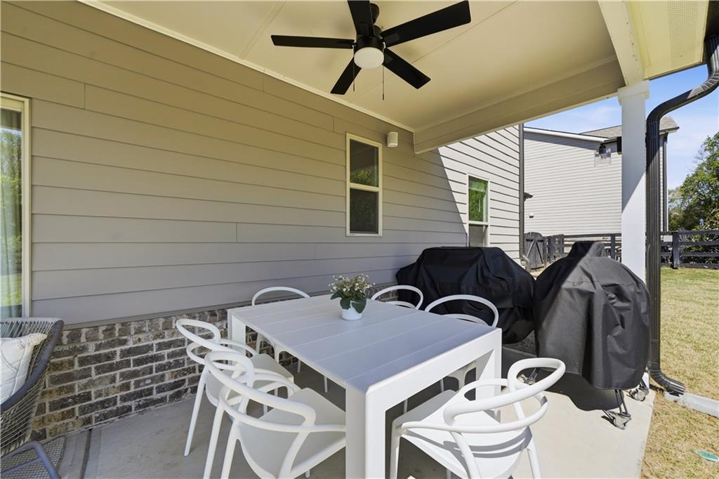 462 Carmichael Circle Canton, GA 30115 - Photo 49 of 70 a backyard of a house with table and chairs