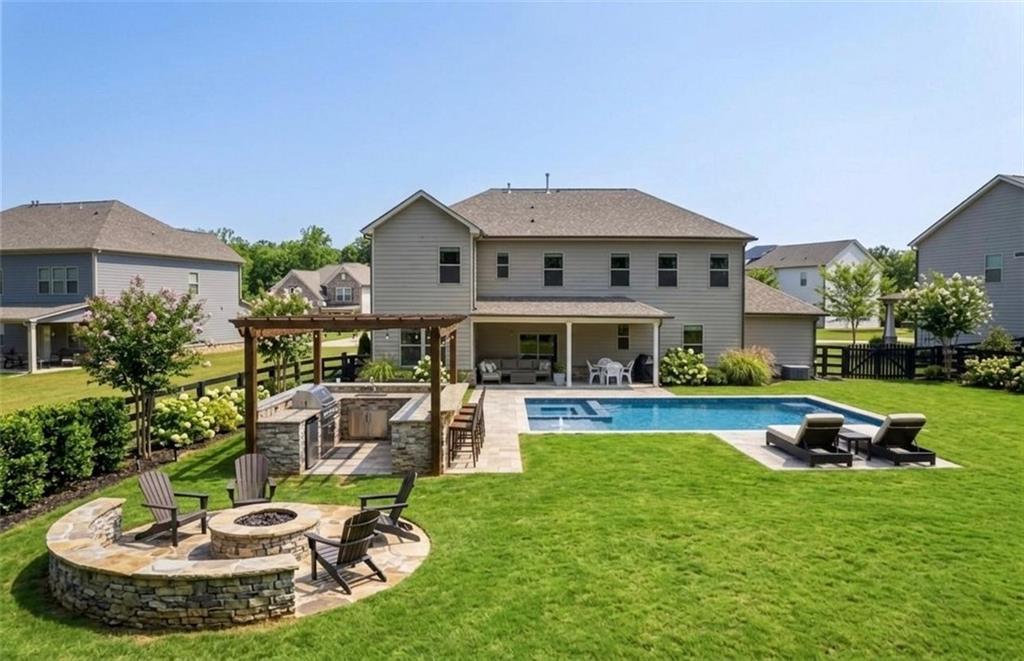 462 Carmichael Circle Canton, GA 30115 - Photo 56 of 70 a view of a house with swimming pool and a yard