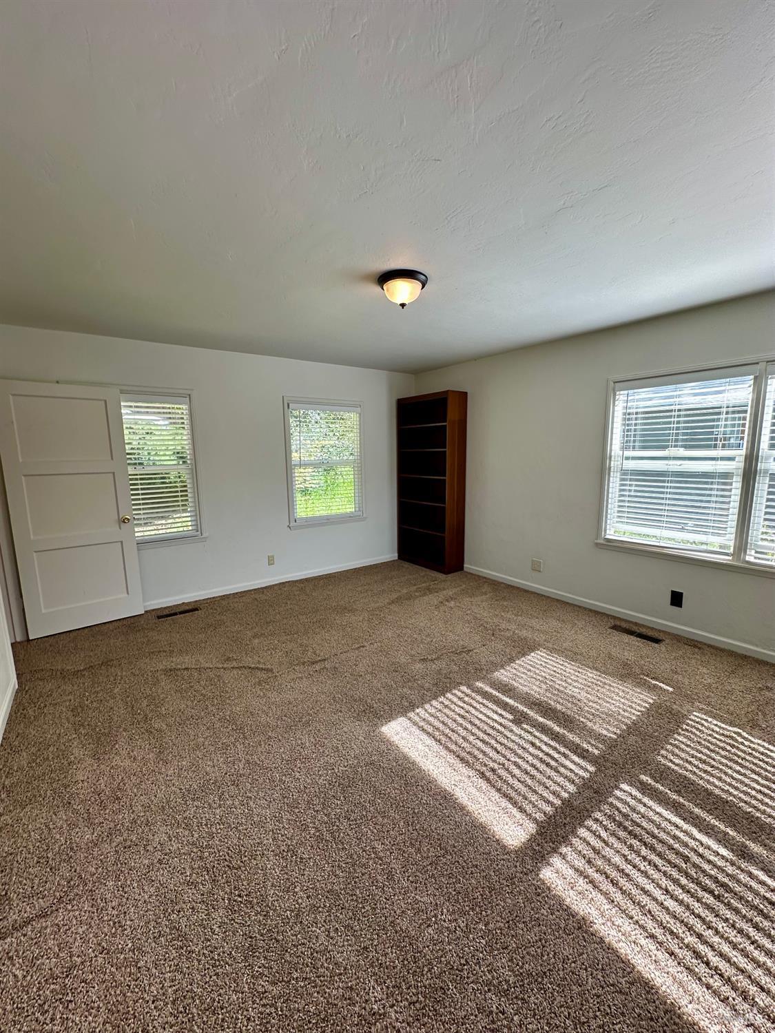 908 Sanitarium Road Deer Park, CA 94576 - Photo 4 of 14 a view of an empty room with a window