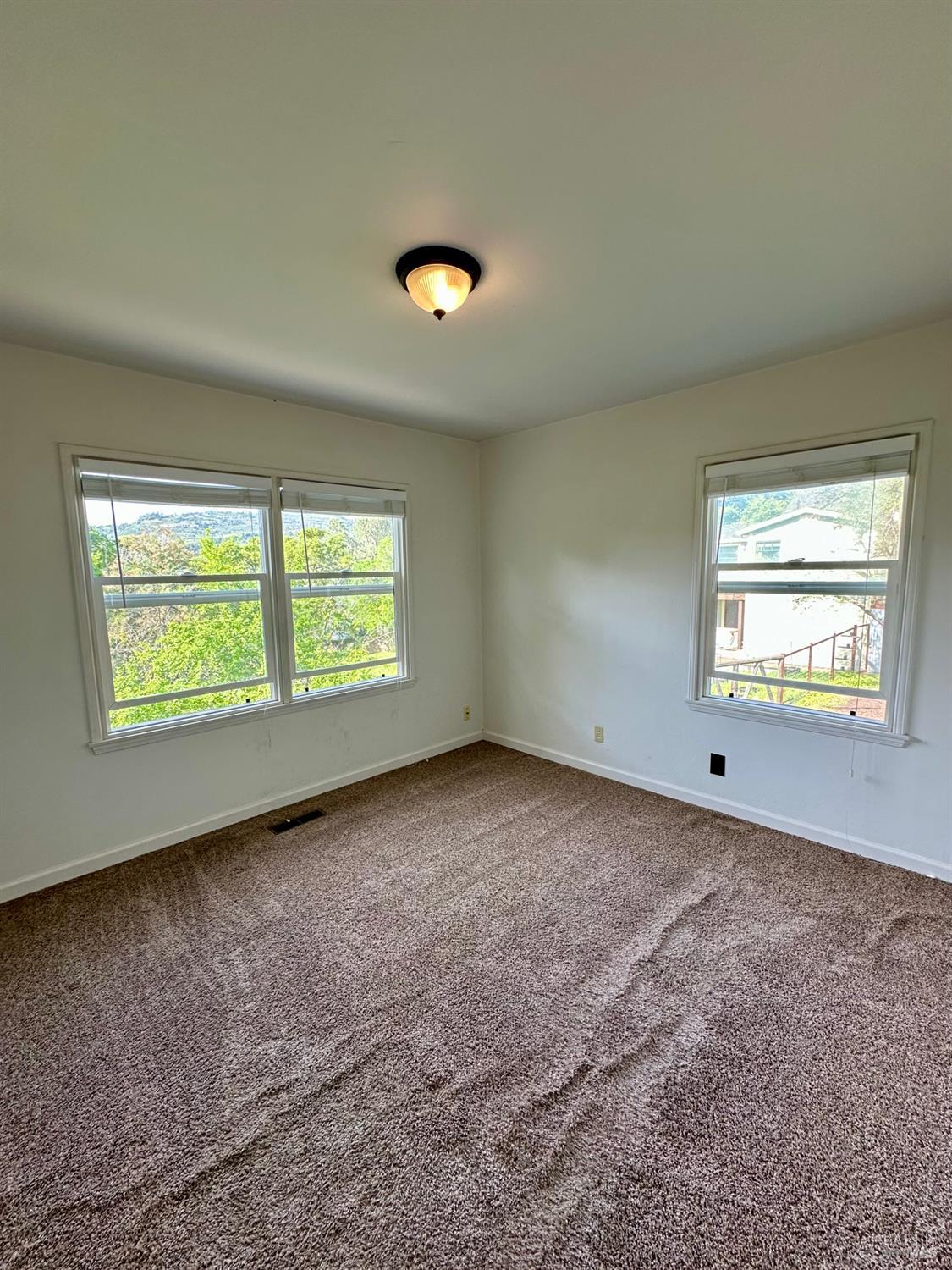 908 Sanitarium Road Deer Park, CA 94576 - Photo 7 of 14 an empty room with windows