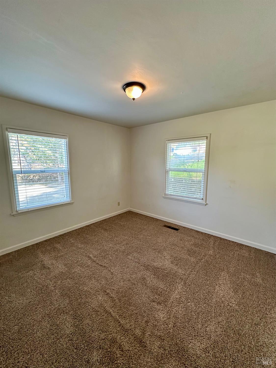 908 Sanitarium Road Deer Park, CA 94576 - Photo 10 of 14 an empty room with windows