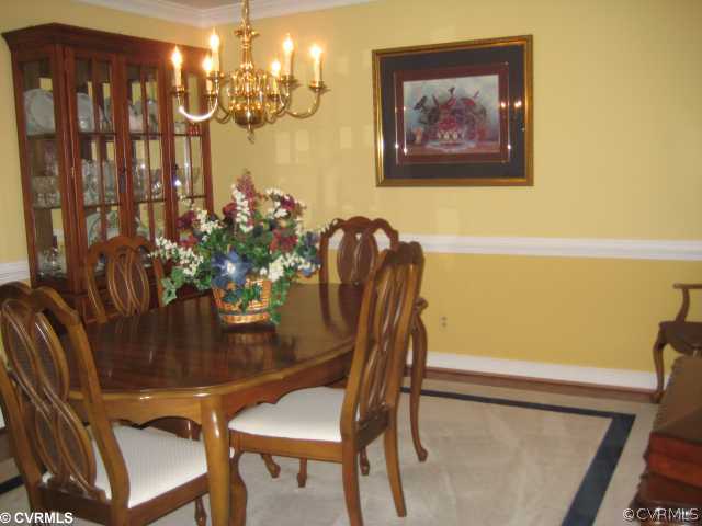 2421 Olde Stone Road Midlothian, VA 23113 - Photo 3 of 11 a view of a dining room with furniture and chandelier