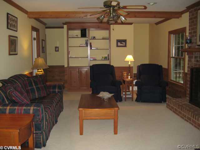 2421 Olde Stone Road Midlothian, VA 23113 - Photo 6 of 11 a living room with furniture and a lamp