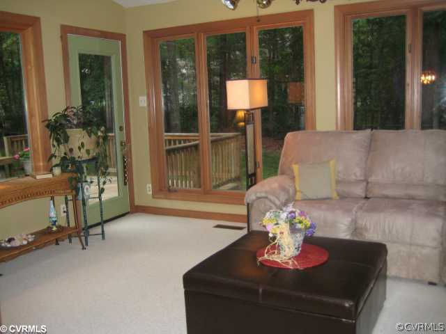 2421 Olde Stone Road Midlothian, VA 23113 - Photo 7 of 11 a living room with furniture and a floor to ceiling window