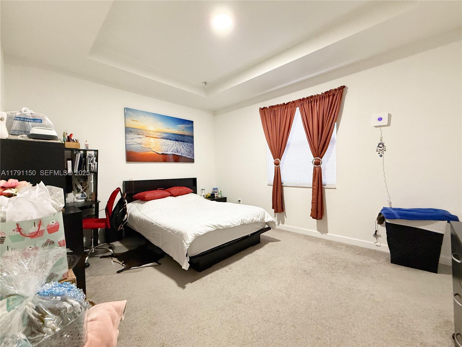 11871 Southwest 247th Terrace Homestead, FL 33032 - Photo 15 of 23 a bedroom with a bed and window