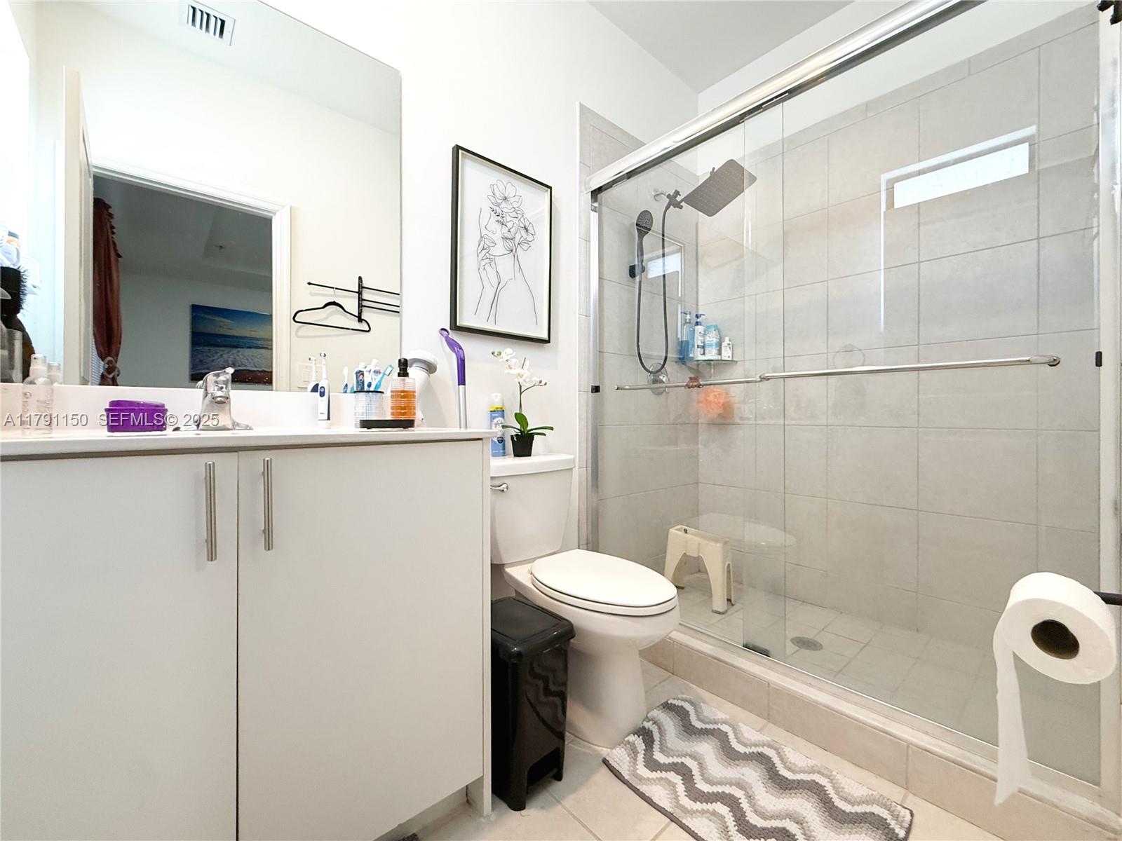 11871 Southwest 247th Terrace Homestead, FL 33032 - Photo 16 of 23 a bathroom with a sink toilet and shower