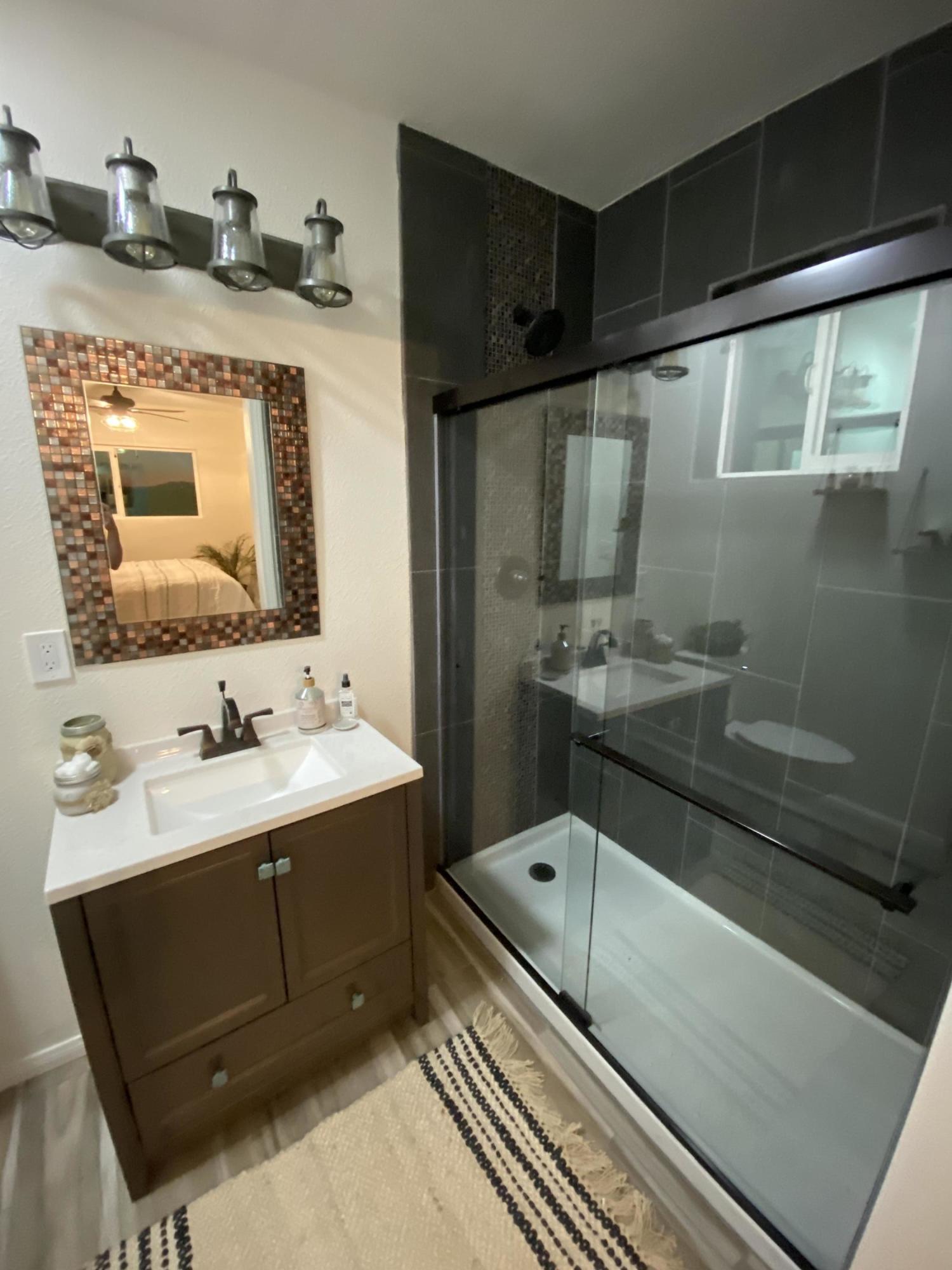 54836 Alderman Road Landers, CA 92285 - Photo 11 of 32 a bathroom with a sink and a mirror