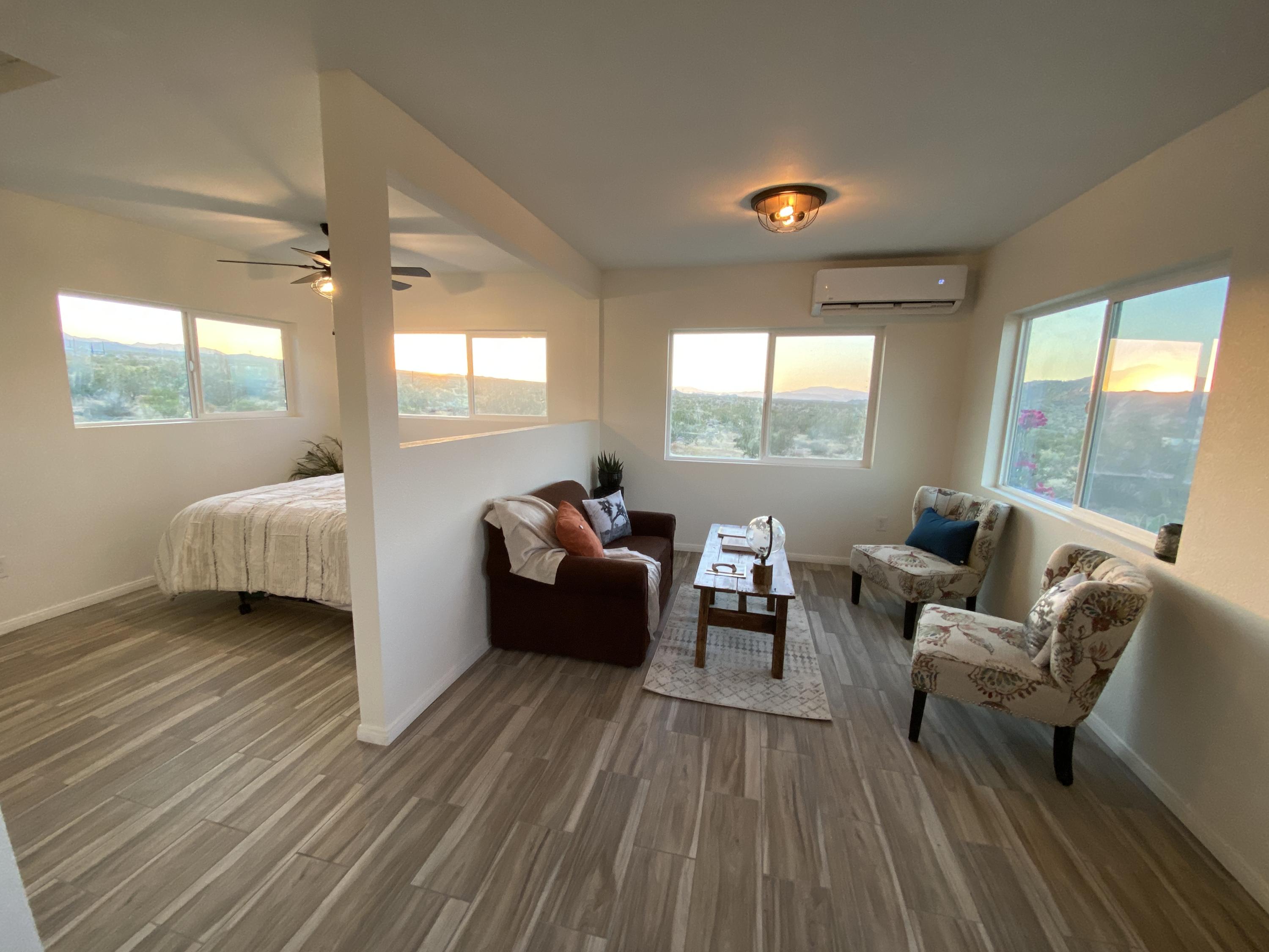 54836 Alderman Road Landers, CA 92285 - Photo 5 of 32 a living room with furniture and a large window